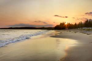 The sun sets beside a campground on Rissers Beach, Nova Scotia