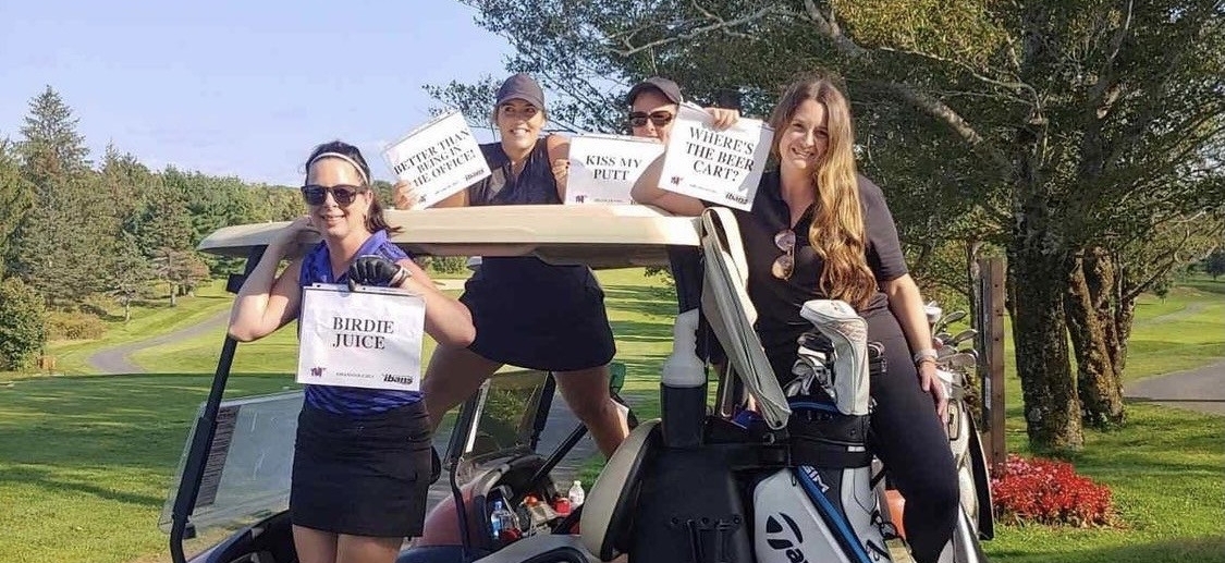 Cheep Team on a golf cart